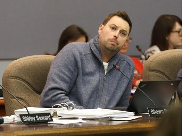 Shawn Menard listens to a delegation during the school board meeting.