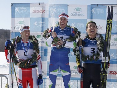 Skier Andy Shields, centre, celebrates winning the 51km classic style Gatineau Loppet cross-country ski race with second place finisher Ryan Jackson, right, and third place finisher Karl Saidla in Gatineau on Saturday, February 18, 2017.
