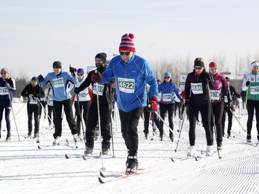 Skiers take part in the 27 km classic style Gatineau Loppet cross-country ski race in Gatineau on Saturday, February 18, 2017.