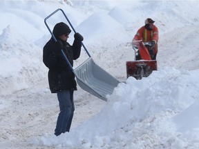 Ottawa residents on Bower Street try and dig out of 30 cm of snow in Ottawa Monday Feb 13, 2017.