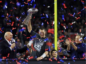 Tom Brady of the New England Patriots holds the Vince Lombardi Trophy after defeating the Atlanta Falcons 34-28 in overtime.