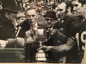 Sam Berger at the Olympic Stadium in Montreal in 1976, with then-prime minister Pierre Trudeau on the left. After almost 40 years with the Ottawa Rough Riders, he bought the Alouettes in 1970.