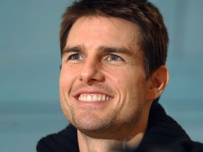 Actor Tom Cruise flashes his trademark winning smile during a press conference in Toronto for the world premier of the film 'Vanilla Sky.'