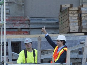 Prime minister-designate Justin Trudeau gives the thumbs up to workers as he tours the West block construction site Tuesday Nov.3, 2015 in Ottawa. THE CANADIAN PRESS/Adrian Wyld ORG XMIT: ajw103