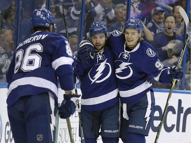 Tampa Bay Lightning center Tyler Johnson (9) celebrates with right wing Nikita Kucherov (86), of Russia, and center Vladislav Namestnikov (90), also of Russia, after scoring against the Ottawa Senators during the second period of an NHL hockey game Thursday, Feb. 2, 2017, in Tampa, Fla.