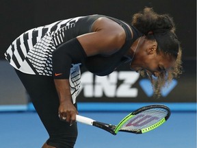 Serena Williams smashes her racket during a match against her sister, Venus, in the women's singles final at the Australian Open tennis championships in Melbourne on Saturday, Jan. 28, 2017.