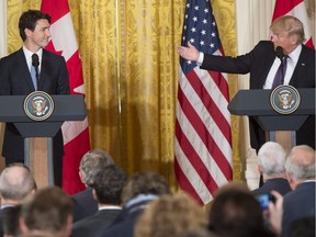 US President Donald Trump and Canadian Prime Minister Justin Trudeau hold a joint press conference in the East Room of the White House in Washington, DC, February 13, 2017. /