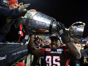 Moton Hopkins #95 of the Ottawa Redblacks hoists the Grey Cup following the 104th Grey Cup Championship Game against the Calgary Stampeders at BMO Field on November 27, 2016 in Toronto.