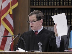 Judge Jeffrey Locke asks a question before the examination of a witness during the double murder trial of former New England Patriots tight end Aaron Hernandez at Suffolk Superior Court Monday, March 6, 2017, in Boston. Hernandez is standing trial for the July 2012 killings of Daniel de Abreu and Safiro Furtado who he encountered in a Boston nightclub. The former NFL player is already serving a life sentence in the 2013 killing of semi-professional football player Odin Lloyd. (AP Photo/Stephan S