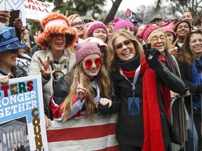 FILE - In this Jan. 21, 2017 file photo, Gloria Steinem, center right, greets protesters at the barricades before speaking at the Women&#039;s March on Washington during the first full day of Donald Trump&#039;s presidency, in Washington. Organizers of the January Women&#039;s March are calling for women to take the day off and encouraging them not to spend money Wednesday, March 8, 2017, to show their economic strength and impact on American society. &ampquot;A Day Without a Woman&ampquot; is the first national action by org