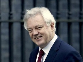 FILE - A Tuesday, Jan. 17, 2017 file photo of British Secretary of State for Exiting the European Union, David Davis, arriving at 10 Downing Street in London. Davis said Sunday, March 12, 2017 that lawmakers should let Prime Minister Theresa May &ampquot;get on with the job&ampquot; of quitting the bloc _ and the main opposition Brexit spokesman says he expects the divorce papers to be filed this week. Brexit Secretary David Davis said Sunday that lawmakers should pass a bill authorizing exit talks on Monday wi