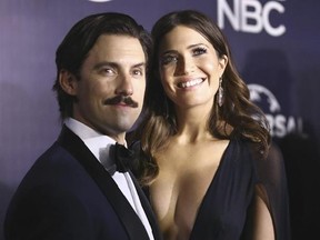 FILE - This Jan. 8, 2017 file photo shows Milo Ventimiglia, left, and Mandy Moore at the NBCUniversal Golden Globes afterparty in Beverly Hills, Calif. The season finale for the popular time-twisting family drama will air Tuesday at 9 p.m. EST on NBC. (Photo by Rich Fury/Invision/AP, File)