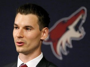 In this May 5, 2016, file photo, Arizona Coyotes general manager John Chayka speaks at a news conference in Glendale, Ariz. While taking in a Panthers game on break from the NHL general managers in Florida earlier this month, the youngest GM in pro sports history picked the brain of one of hockey&#039;s greatest players and savviest managers. Chayka wanted to know how Steve Yzerman went about constructing Team Canada&#039;s Olympic and world championship teams, and how the process helped him develop as a