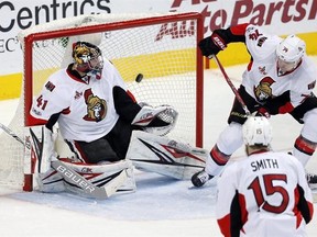 Ottawa Senators&#039; Zack Smith (15) watches as a shot by Dallas Stars&#039; Jason Spezza, not pictured, deflects off of Mark Borowiecki (74) and gets by goalie Craig Anderson for a score in the third period of an NHL hockey game in Dallas, Wednesday, March 8, 2017. The Senators will be without No. 1 netminder Anderson for at least another game.THE CANADIAN PRESS/AP/Tony Gutierrez