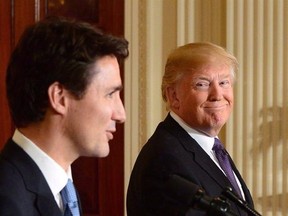 Prime Minister Justin Trudeau and U.S. President Donald Trump take part in a joint press conference at the White House in Washington, D.C., in a February 13, 2017, file photo. Trudeau tells an American network interview he still believes President Trump&#039;s promise on NAFTA ??? that adjustments in the Canada-U.S. trading relationship will be minor.THE CANADIAN PRESS/Sean Kilpatrick