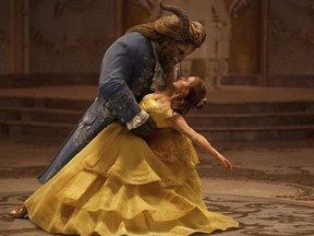 This image released by Disney shows Dan Stevens as The Beast, left, and Emma Watson as Belle in a live-action adaptation of the animated classic 'Beauty and the Beast.'