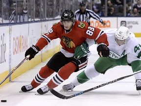 Chicago Blackhawks right winger&#039; Patrick Kane (88) and Toronto Maple Leafs centre Tyler Bozak (42) vie for the puck during first period NHL hockey action in Toronto on Saturday, March 18, 2017. Sidney Crosby and Connor McDavid have company in Kane as the NHL&#039;s MVP race heats up. THE CANADIAN PRESS/Nathan Denette