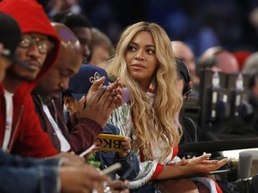 FILE - In this Feb. 19, 2017. file photo, Beyonce sits at court side during the second half of the NBA All-Star basketball game in New Orleans. A Houston high school student lost her battle with cancer on March 25, 2017, days after receiving a FaceTime call from the singer. (AP Photo/Max Becherer, File)