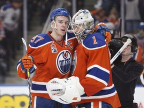 Edmonton Oilers&#039; Connor McDavid (97) congratulates goalie Laurent Brossoit (1) on his win during third period NHL action against the Colorado Avalanche, in Edmonton on Saturday, March 25, 2017.The embarrassment of an empty Canadian spring in the NHL has been wiped away.Canadian teams have made huge strides, as a whole, from last season when all seven squads missed out on the playoffs for the first time since 1970. THE CANADIAN PRESS/Codie McLachlan