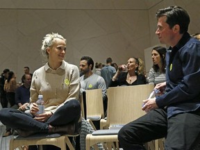 In this March 8, 2017 photo, Steph Jensen, left, and Brian Shaw chat during a sober social event sponsored by The Shine at a chic boutique hotel in the Williamsburg section of the Brooklyn borough of New York. The Shine has the feel of a variety show, with mindfully-curated content in Los Angeles and New York once every two months, and includes everything from guided meditation to comedians to beat boxers. (AP Photo/Kathy Willens)
