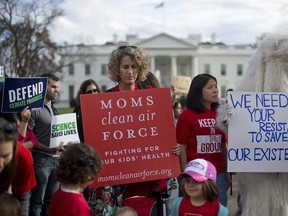 FILE - In this Tuesday, March 28, 2017 file photo, demonstrators gather in front of the White House in Washington, during a rally against President Donald Trump&#039;s Energy Independence Executive order. Environmental groups are preparing to go to court to battle Trump&#039;s efforts to roll back his predecessor&#039;s plans to curb global warming. But they say their first order of business is to mobilize a public backlash against an executive order Trump signed on Tuesday that eliminates many restrictions of