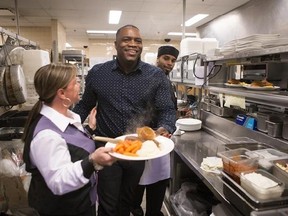 Jason Brown, centre, who has been nominated for Reggae Recording of the year at this year&#039;s Juno Awards under his moniker Jay Kartier for &ampquot;Who Feels It Knows&ampquot; is pictured in the kitchen of the OLG Slots in Ajax, Ont., on Saturday, March 25, 2017, where he works as a supervisor in the food and beverage department. THE CANADIAN PRESS/Chris Young