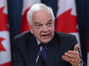 Immigration, Refugees and Citizenship Minister John McCallum speaks during a press conference at the National Press Theatre in Ottawa on Wednesday, Dec. 14, 2016. McCallum, Canada&#039;s newly arrived ambassador to China, says human rights and labour standards will form part of any potential free trade agreement between the two countries. THE CANADIAN PRESS/Sean Kilpatrick