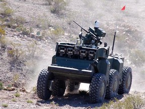 Known more formally as lethal autonomous weapons systems, the spectre of deadly-efficient technology came up during an open caucus meeting of Senate Liberals who were exploring the pros and cons of AI and robotics. In this photo provided by the Defense Advanced Research Projects Agency/Carnegie Mellon, the U.S. Army&#039;s new Crusher combat robotic vehicle makes its way through the desert at White Sands Missile Range, New Mexico, Tuesday Feb. 19, 2008. THE CANADIAN PRESS/AP- Defense Advanced Researc