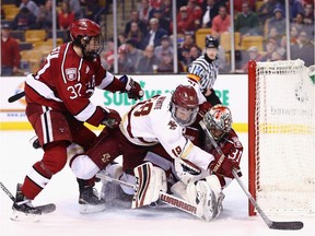 Colin White gets into the middle of the action in the crease during Boston College's game against Harvard on Feb. 1, 2017. in Boston.