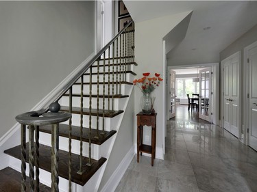 A combination foyer and mudroom was created between the front and garage entrances, designed for flexibility in use.