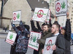Some of the 'budtenders' charged with drug trafficking after police raids on marijuana dispensaries gathered with a few supporters in a protest outside the courthouse Wednesday.