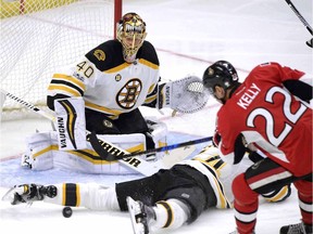 Senators forward Chris Kelly has his shot blocked by Bruins defenceman Adam McQuaid (54) during a March 6 game at Canadian Tire Centre in Ottawa.