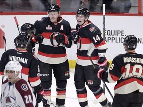 The Ottawa Senators' Alex Burrows (14) and his new teammates celebrate his second goal of the game against the Colorado Avalanche on Thursday, March 2, 2017.