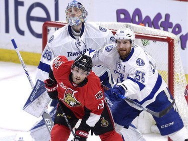Tampa Bay Lightning goalie Andrei Vasilevskiy (88) looks for the puck as teammate Braydon Coburn (55) tries to keep Ottawa Senators' Derick Brassard (19) out of the crease during second period NHL hockey action in Ottawa, Tuesday, March 14, 2017.