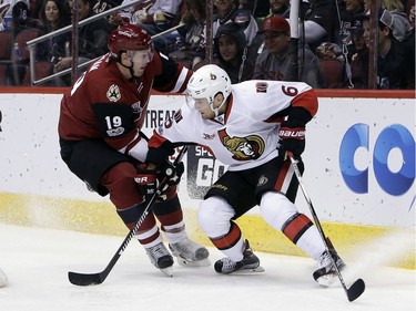 Arizona Coyotes right wing Shane Doan (19) and Ottawa Senators defenseman Chris Wideman skate for the loose puck during the second period during an NHL hockey game, Thursday, March 9, 2017, in Glendale, Ariz.