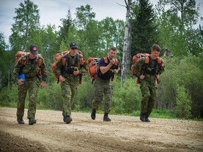 Then Corporal Alfred Barr, second from the left, takes part in the Canadian Forces search and rescue technician course in the vicinity Jarvis Lake, Alberta on June 6, 2016. Photo: Corporal PJJ Létourneau.