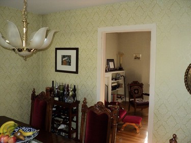 Before: A cramped formal dining room with a small entrance to the living room.