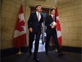 Finance Minister Bill Morneau and Prime Minister Justin Trudeau hold copies of the 2017 federal budget, which introduced the Canada Infrastructure Bank.
