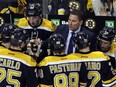 Bruce Cassidy, top right, talks to Bruins players during a timeout in the third period of a Feb. 9 home game against the San Jose Sharks. (AP Photo/Elise Amendola)