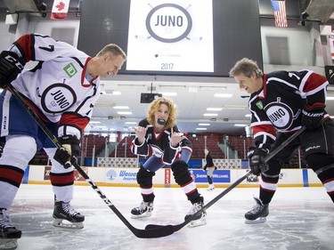 Canadian music celebrities and some hockey stars came together at TD Place arena Thursday March 30, 2017 for a practice a day before the big Juno Cup hockey game. Gary Roberts (left) faced off with Jim Cuddy as Kathleen Edwards just couldn't resist having a little fun during a mock puck drop.