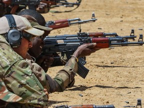 A Canadian Special Operations Forces soldier coaches a Niger Army soldier during marksmanship training as part of Exercise Flintlock 2017 in Diffa, Niger, Feb. 28, 2017. Canada was one of four western partner nations in Niger and one of 24 nations to participate in the Flintlock 17 throughout North and West Africa.
