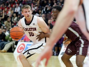 Carleton's Connor Wood is defended by Ottawa's Caleb Agada during a game between the Ravens and Gee-Gees on Feb 3, 2017.