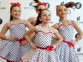 Chelsea Poulen, 8 (centre), is a picture in polka dots as she rehearses with her Gatineau dance troupe, Boogie, in the lobby before their slot on stage.