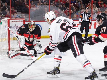 OTTAWA, ON - MARCH 16: Mike Condon #1 of the Ottawa Senators makes a pad save against Tanner Kero #67 of the Chicago Blackhawks in the first period at Canadian Tire Centre on March 16, 2017 in Ottawa, Ontario, Canada.