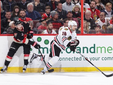 OTTAWA, ON - MARCH 16: Chris Wideman #6 of the Ottawa Senators uses his stick to slow down Marcus Kruger #16 of the Chicago Blackhawks in the second period at Canadian Tire Centre on March 16, 2017 in Ottawa, Ontario, Canada.