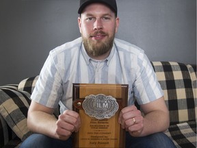 Chris Moberg shows the film award he picked up at the SXSW in Austin, Texas.