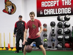 Conditioning coach Chris Schwarz works with Ottawa Senator forward Kyle Turris (R) at the CTC on March 14, 2017.