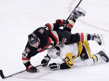 Ottawa Senators' Jean-Gabriel Pageau (44) gets tangled up with Pittsburgh Penguins' Conor Sheary (43) during second period NHL hockey action in Ottawa, Thursday, March 23, 2017.
