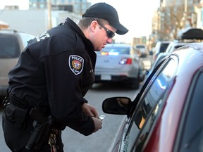 Ottawa police constable Adrian Ring pulling over a driver during a traffic blitz in 2014.