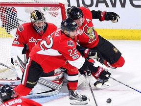 Ottawa Senators goalie Craig Anderson gets a little help from defenceman Dion Phaneuf and centre Chris Kelly (22) during the third period against Columbus at the Canadian Tire Centre on Saturday, March 4, 2017.